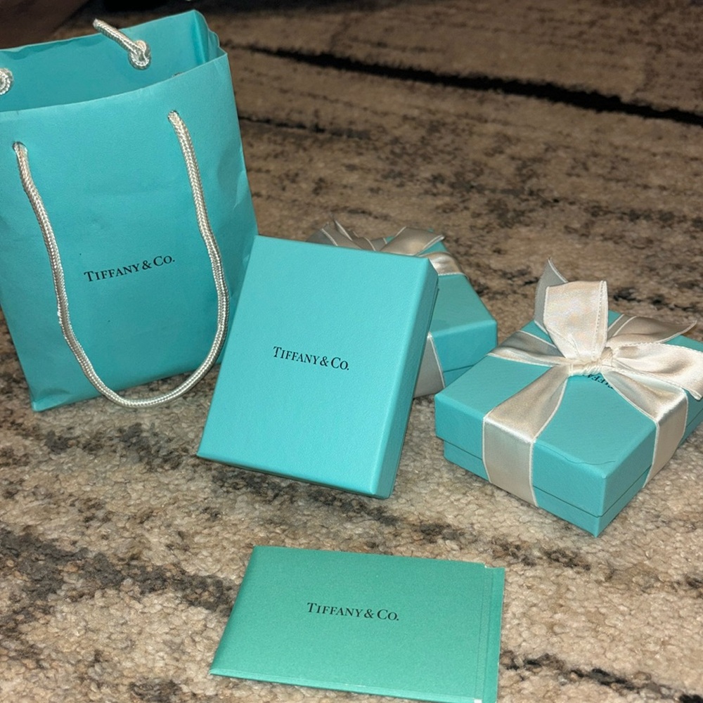 3 empty Tiffany’s boxes and bag